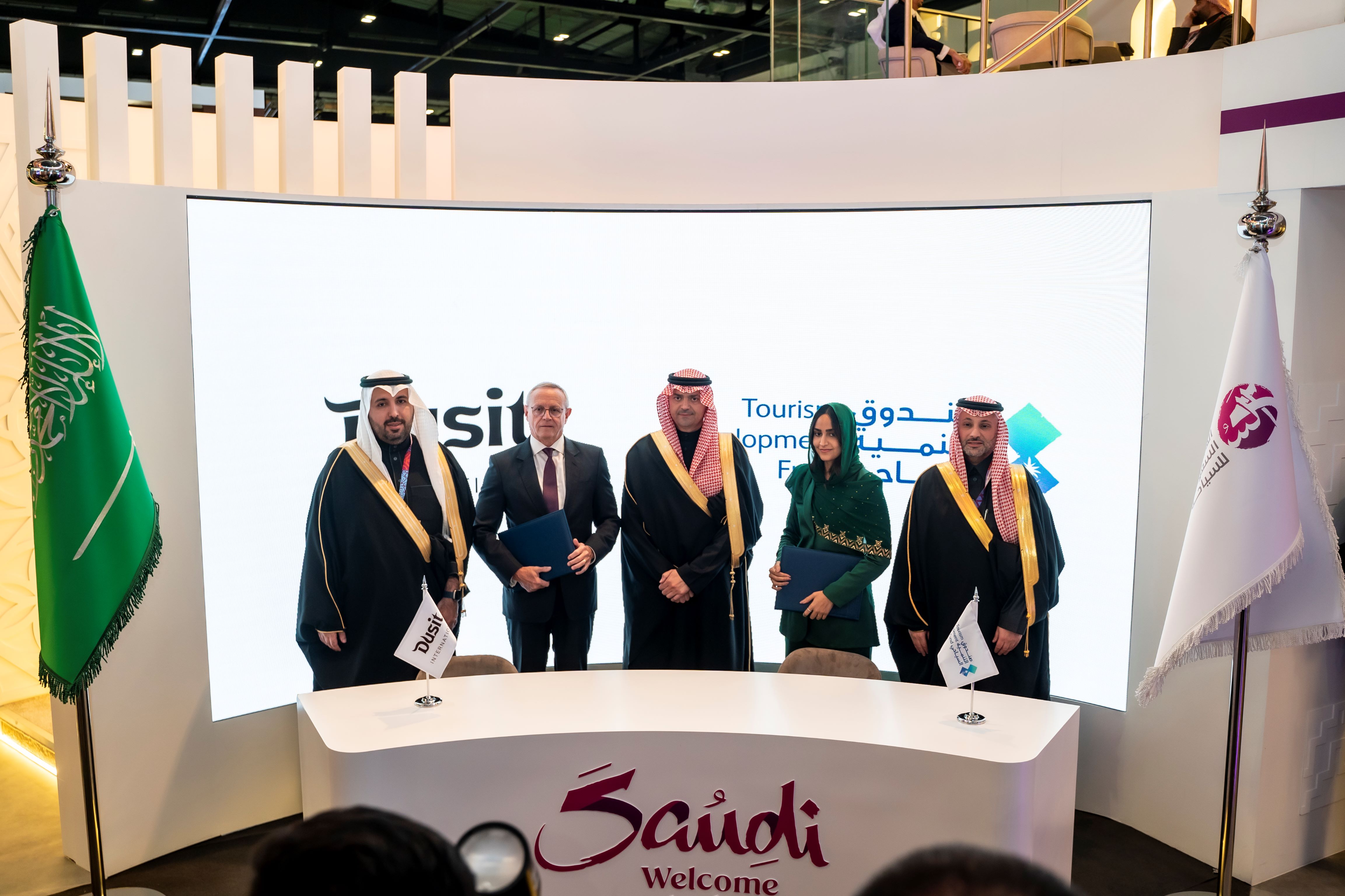 Signed at the World Travel Market 2024 in London, the MoU reflects the vibrant tourism investment opportunities in Saudi Arabia. Pictured (from right): Mohammad Al-Romaizan, Chief of Staff and Corporate Governance Officer, TDF; Her Royal Highness Princess Nouf Alsaud, Acting Director, Decision Support & International Partnership, TDF; Qusai Al-Fakhri, Chief Executive Officer, TDF; Jean-Pierre Trabut, General Manager, Dusit Thani Abu Dhabi; and Naif Al-Madi, Chief Business Officer, TDF.