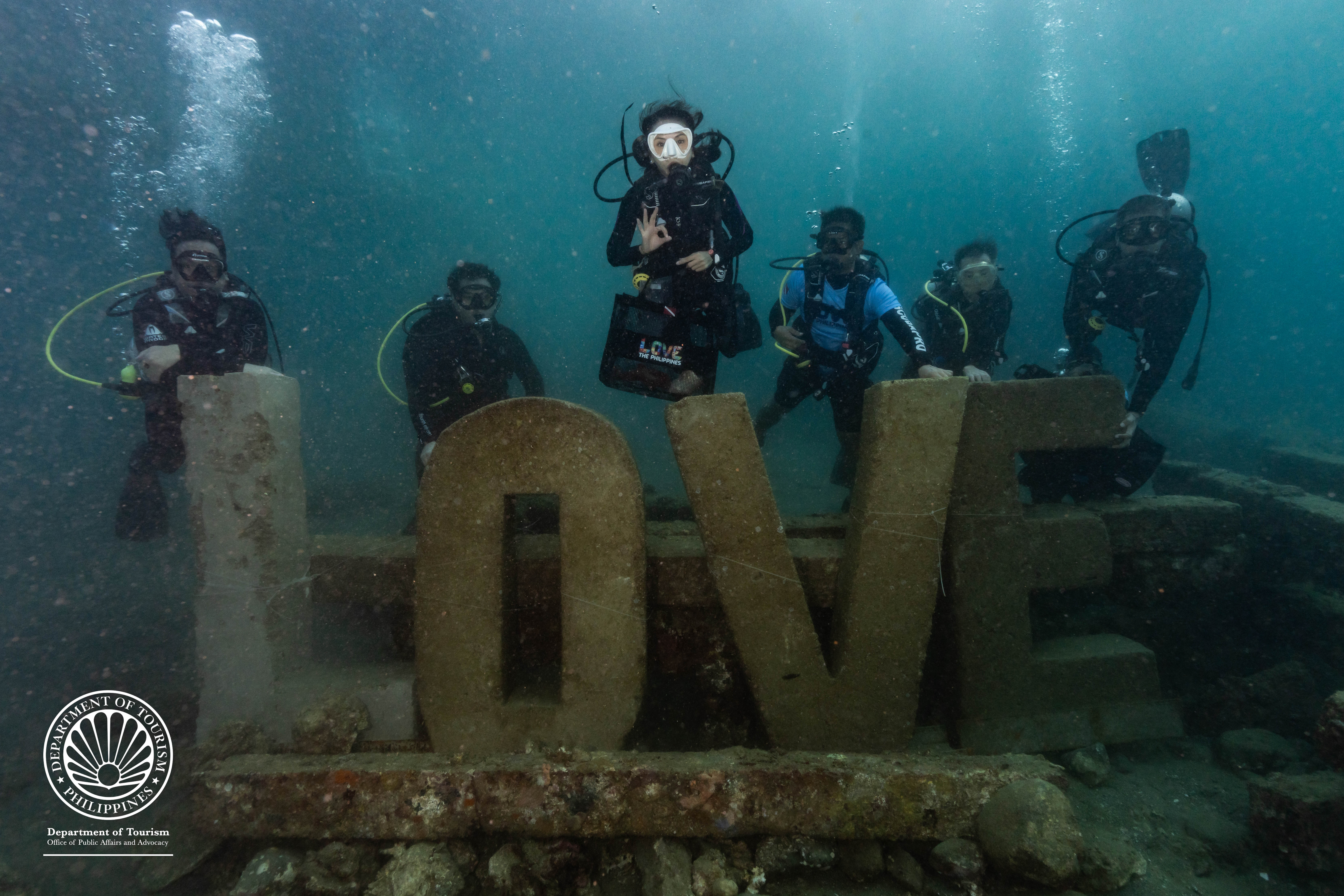 Tourism Secretary Christina Garcia Frasco joins delegates of the Department of Tourism’s inaugural Philippine Dive Experience at LOVE Reef—an artificial structure designed to support coral growth, provide habitat and breeding grounds for marine species, and enhance shoreline protection. Photo by the Philippine Department of Tourism.