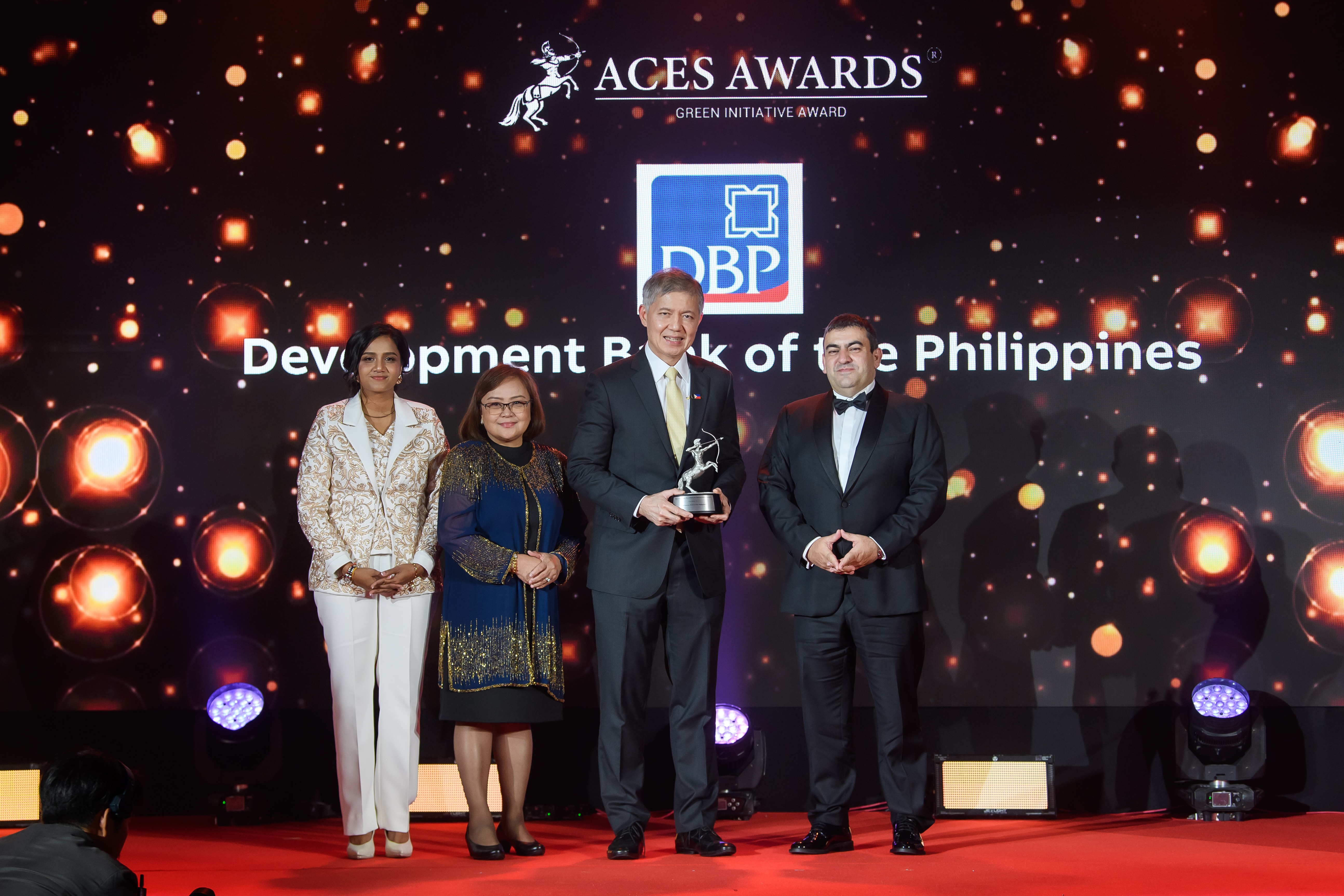 The Development Bank of the Philippines (DBP) shines at the ACES Awards 2024! Receiving the prestigious Green Initiative Award on Day 1, DBP was represented by Michael de Jesus, President and CEO (right center), and Carolyn Olfindo, SVP/Head of the Branch Banking Sector (left center). The award was presented by Dr. Shanggari Balakrishnan, President of the ACES Awards (far left), and Luis Bueno Nieto, Advisor to the ACES Council (far right). Adding to the celebration, Michael de Jesus was honoured on Day 2 with the Outstanding Leaders in Award, in recognition of his exemplary leadership that continues to drive DBP towards sustainable and impactful growth. DBP leading the way in green initiatives and inspiring leadership!