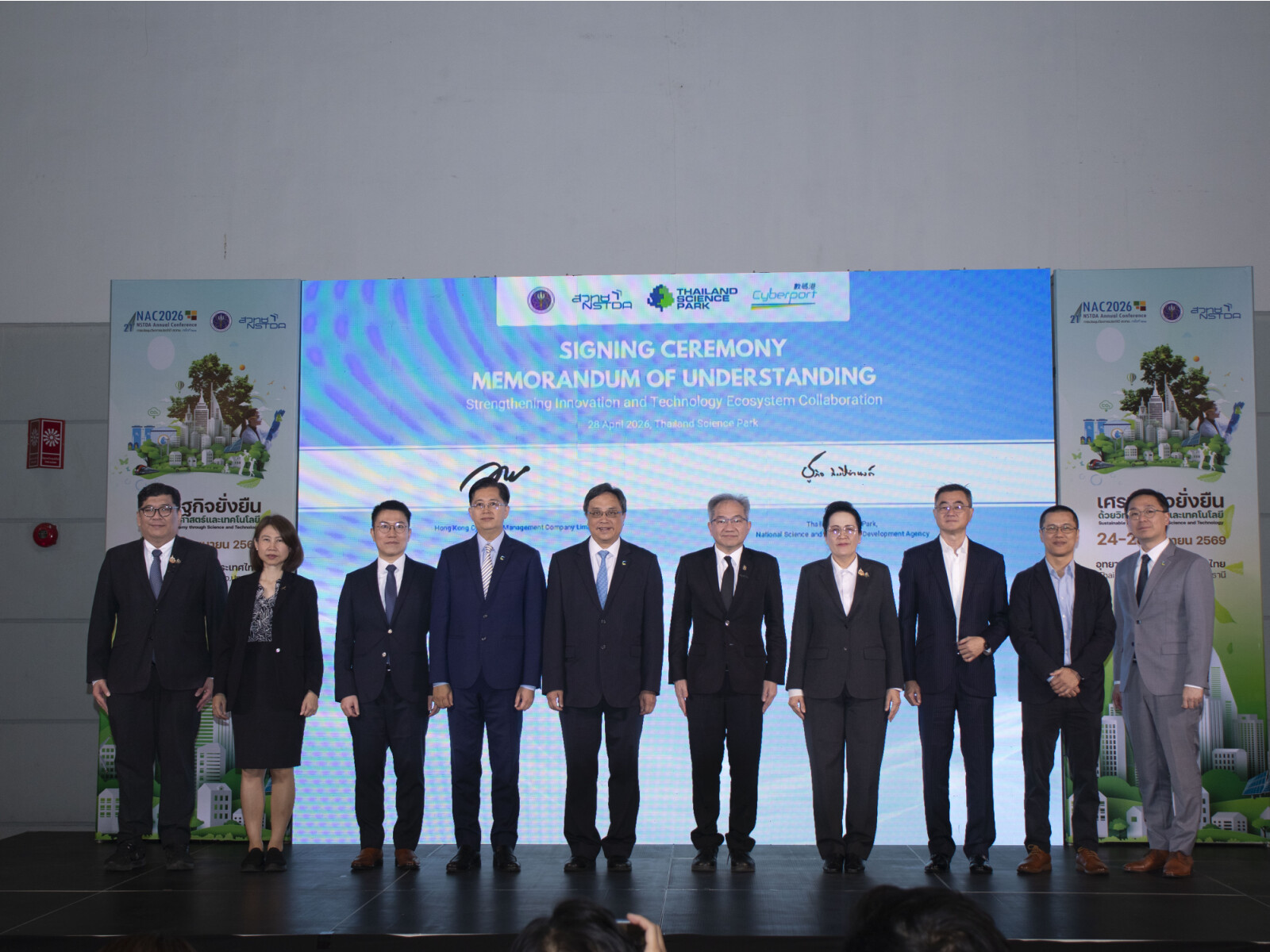 Cyberport today signed a Memorandum of Understanding (MoU) with National Science and Technology Development Agency (NSTDA) acting through Thailand Science Park (TSP), Group photo with Simon Chan, Chairman of Cyberport (centre-left); Dr Sukit Limpijumnong, President of NSTDA (centre-right); Ir Eric Chan, Chief Public Mission Officer of Cyberport (fourth from left); Dr Chularat Tanprasert, Executive Vice President of NSTDA and Director of Thailand Science Park (fourth from right); Parson Lam, Director of the Hong Kong Economic and Trade Office in Bangkok (third from left); Leung Kwan Ho, Associate Director, Hong Kong Trade Development Council (second from right); and Mr Joseph Koc, Ambassador of Thailand (third from right).